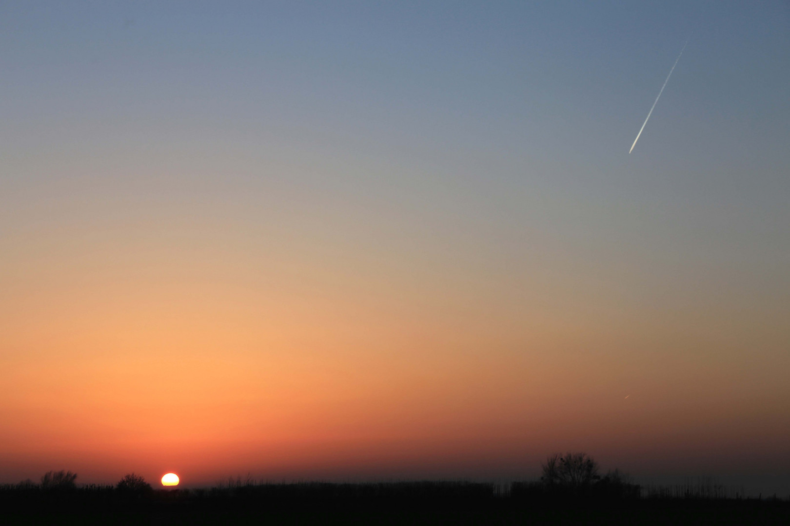 flug in den sonnenuntergang