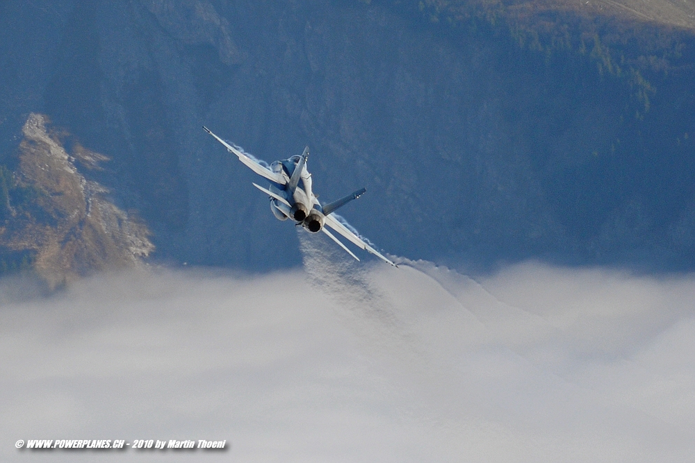 Flying over the foggy valley