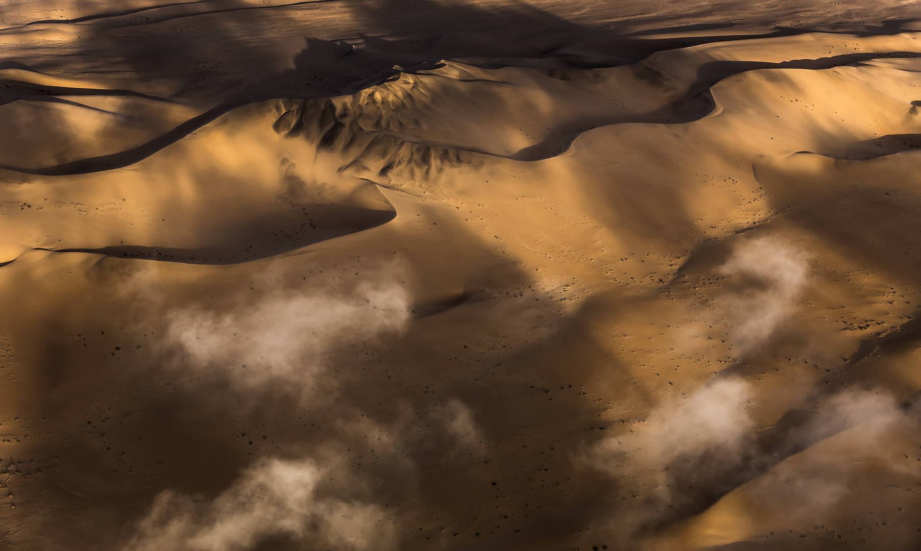 Fog rolling in over the Namib Desert