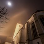 fog surrounds the church yard