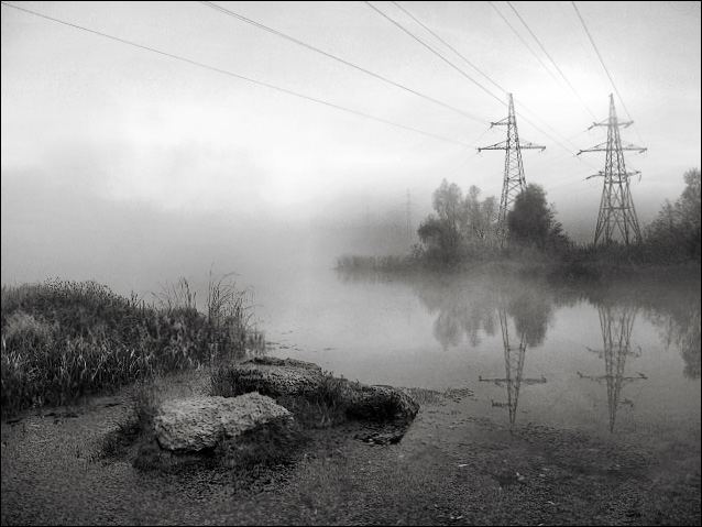 Foggy morning of a city pond.