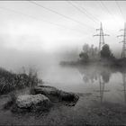 Foggy morning of a city pond.