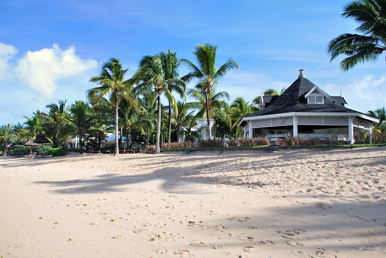 footprints on the warm beach sand