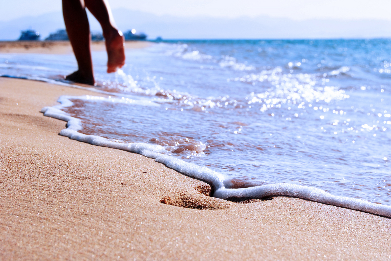 footsteps along the beach