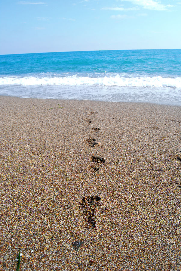 footsteps into the sea