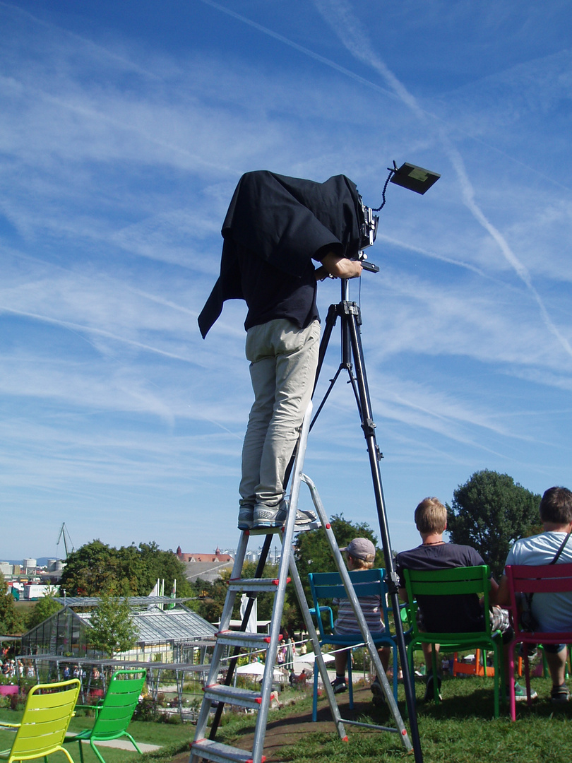 Fotograf auf der Leiter