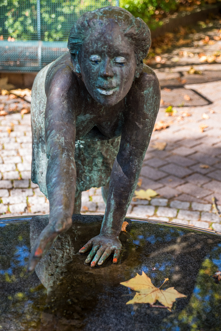 Frau am Brunnen