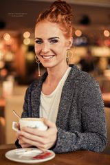 freckled beauty in a coffee shop