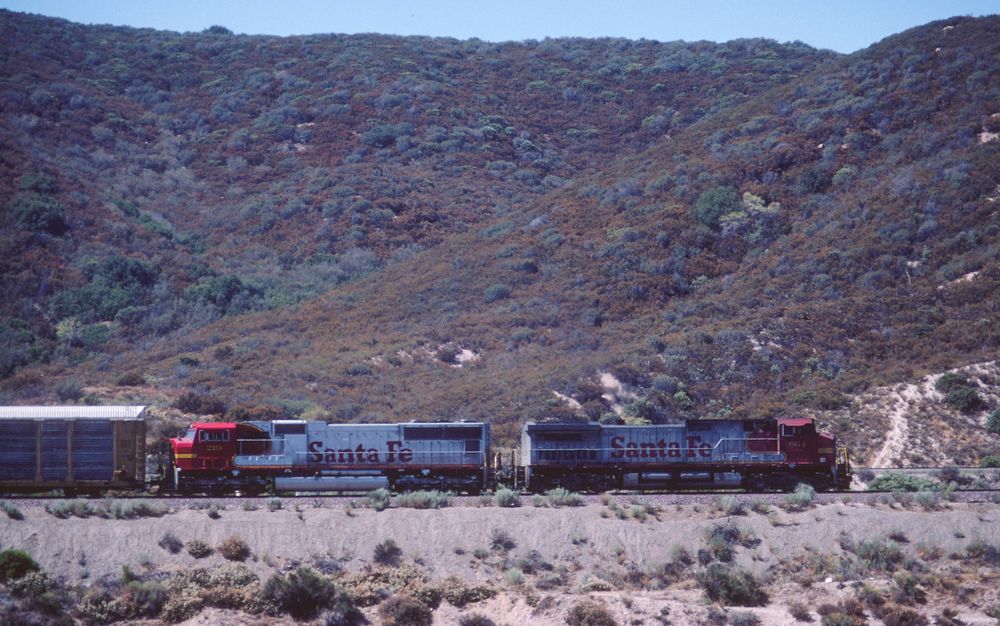 From the old Route 66 View on a passing Enclosed Carrier Cars Train on its way to Cajon Pass, CA