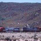 From the old Route 66 View on a passing Enclosed Carrier Cars Train on its way to Cajon Pass, CA