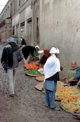 Fruit vendors offer their products after the rain