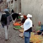 Fruit vendors offer their products after the rain