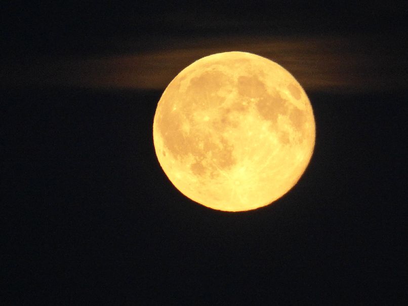 Full Moon in Front of a Cloud