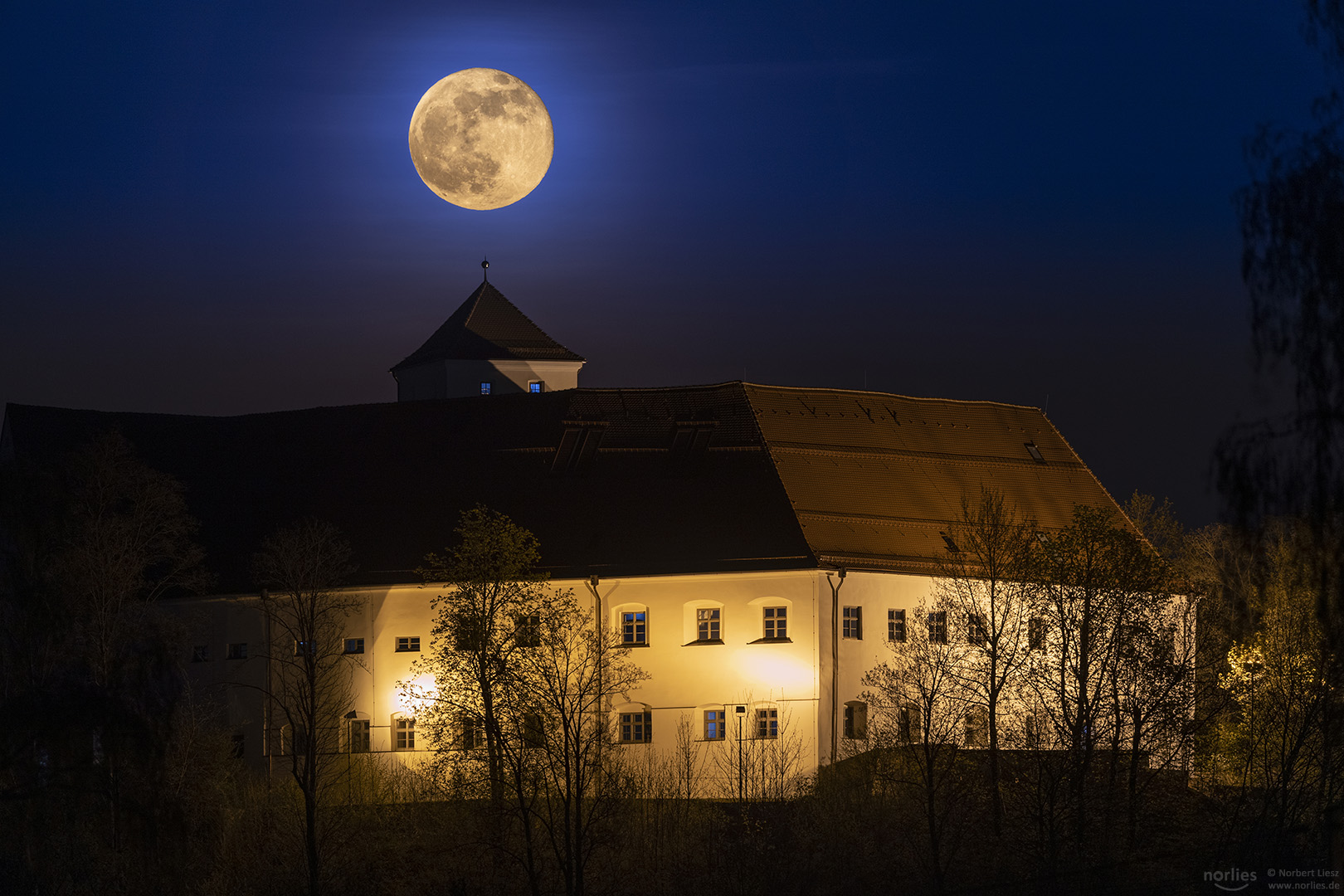 full moon over the castle