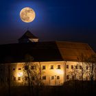 full moon over the castle