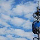 Funkturm vor Weissblauem Himmel / Radio Tower against a White-Blue Sky