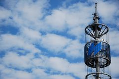 Funkturm vor Weissblauem Himmel / Radio Tower against a White-Blue Sky