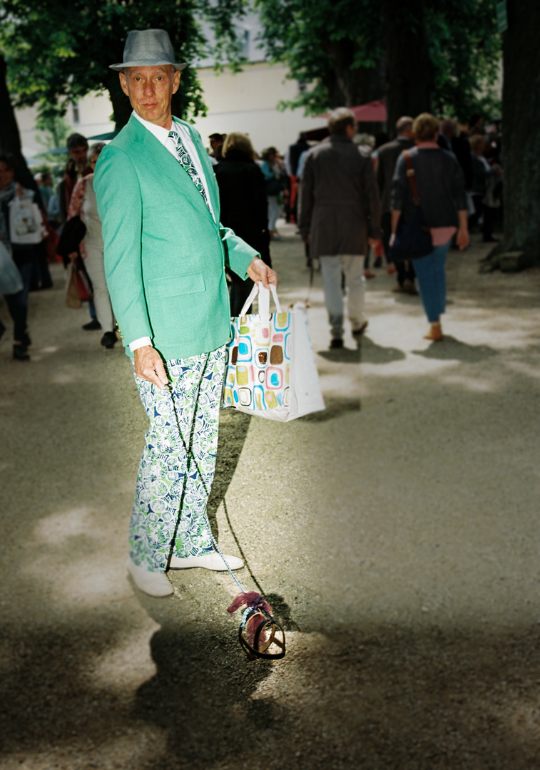 gentleman with hat, a mintish suit and an invisible dog