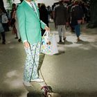 gentleman with hat, a mintish suit and an invisible dog