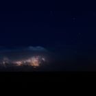 Gewitter am Bodensee / über der Wolkendecke einige Sterne