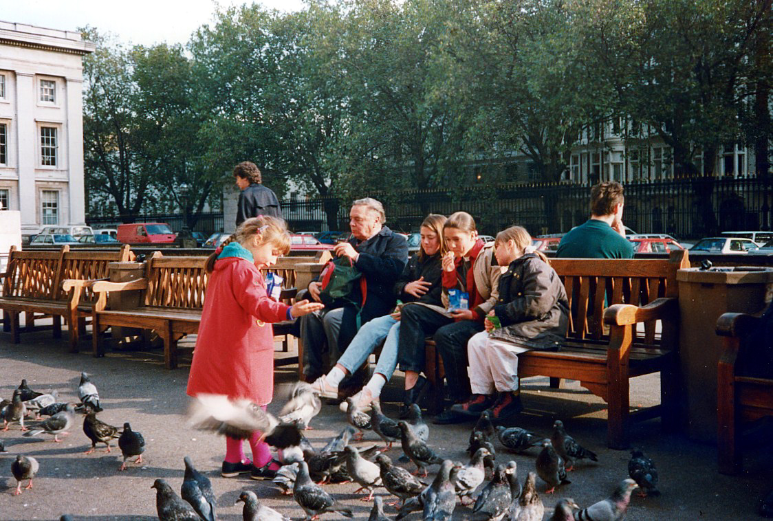 Girl feeding pidgeons