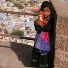 Girl in front of the Blue city!