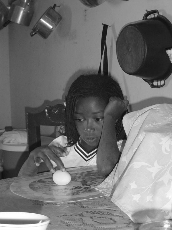 girl playing with egg