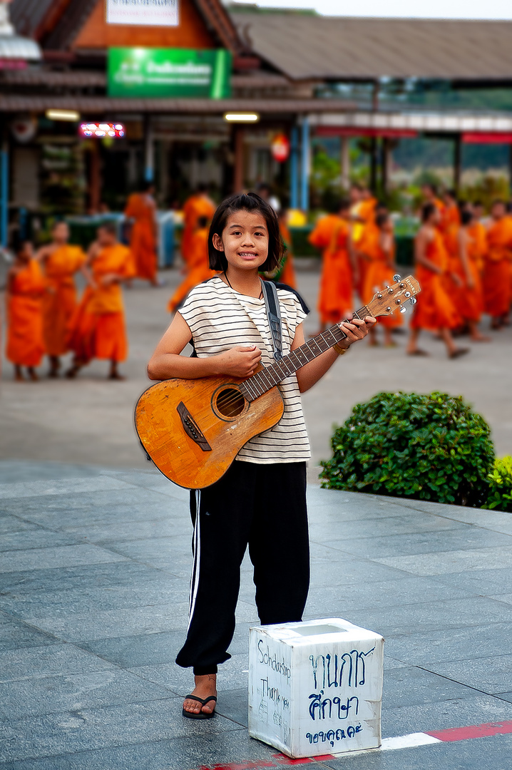 Girl plays for donation