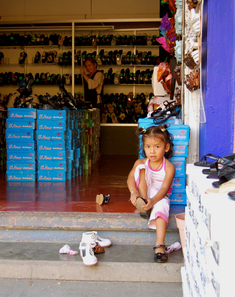 Girl Putting on Shoes