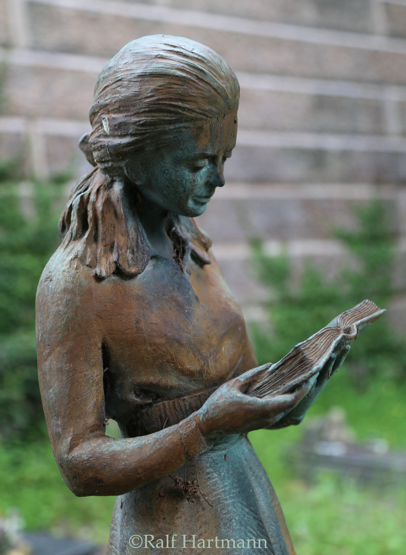 girl reading the Book of Life