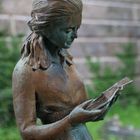 girl reading the Book of Life