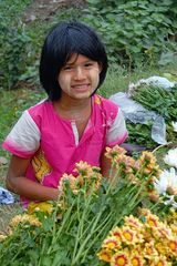 Girl selling flowers in Dala Township