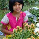 Girl selling flowers in Dala Township