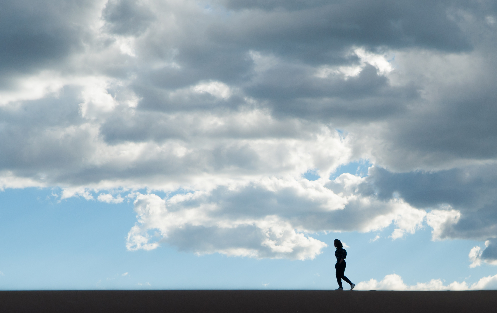 Girl walking on Sand Dune