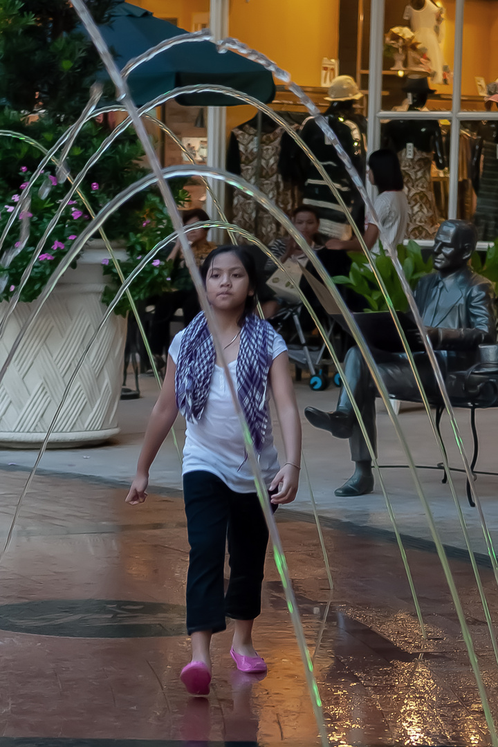 Girl walking through the water bow