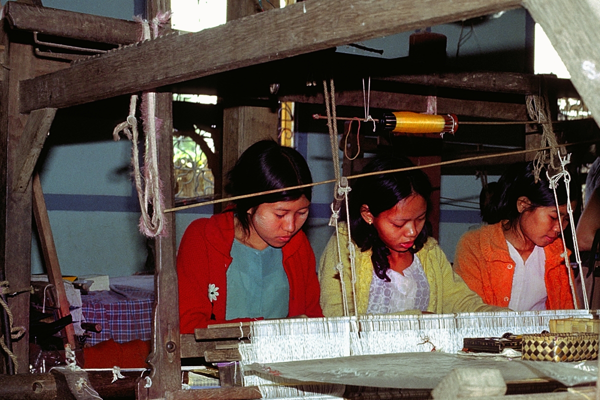 Girls working on a loom