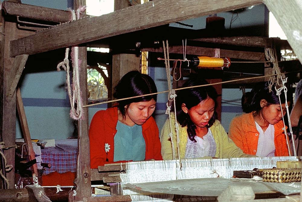 Girls working on a loom