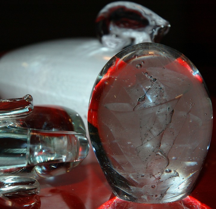 Glass on red platter.