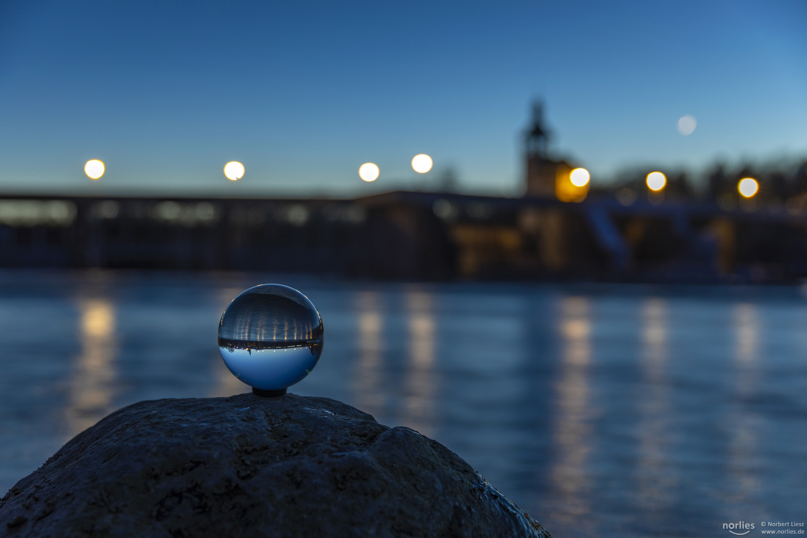 Glass sphere on stone