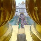 Golden domes. pic from roof of golden temple sangat moving on bridge to golden temple