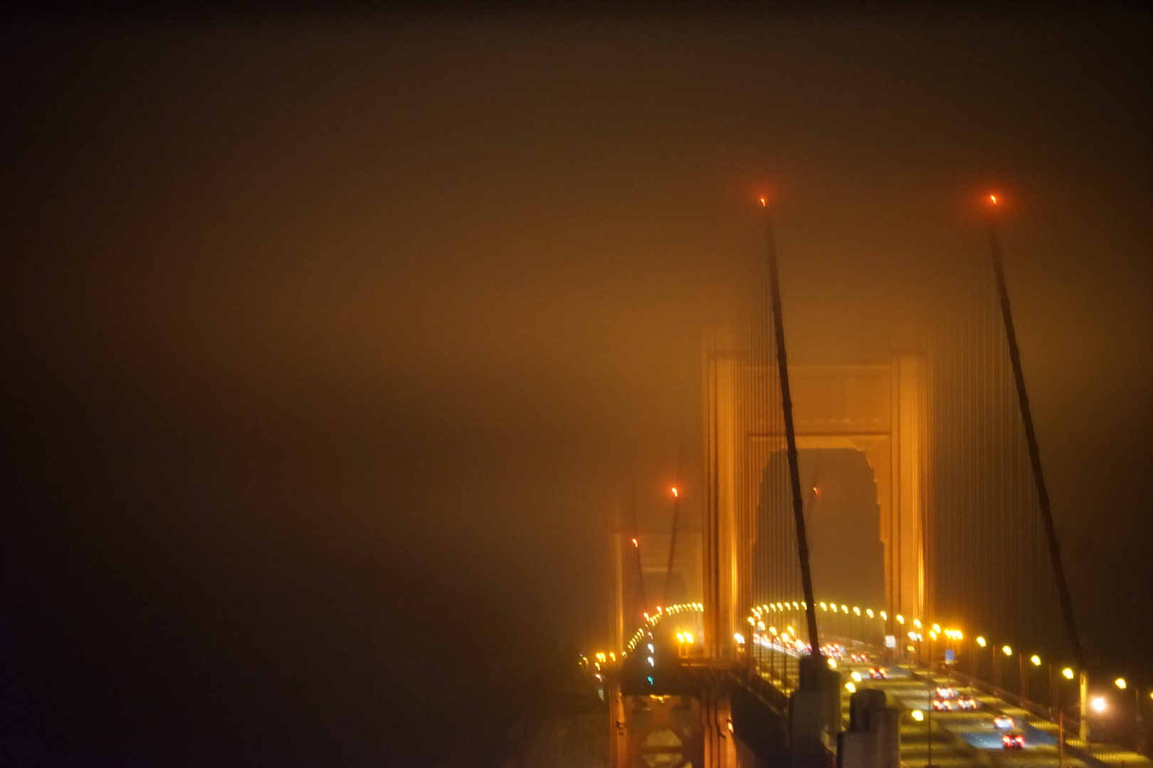 Golden Gate in foggy summer night