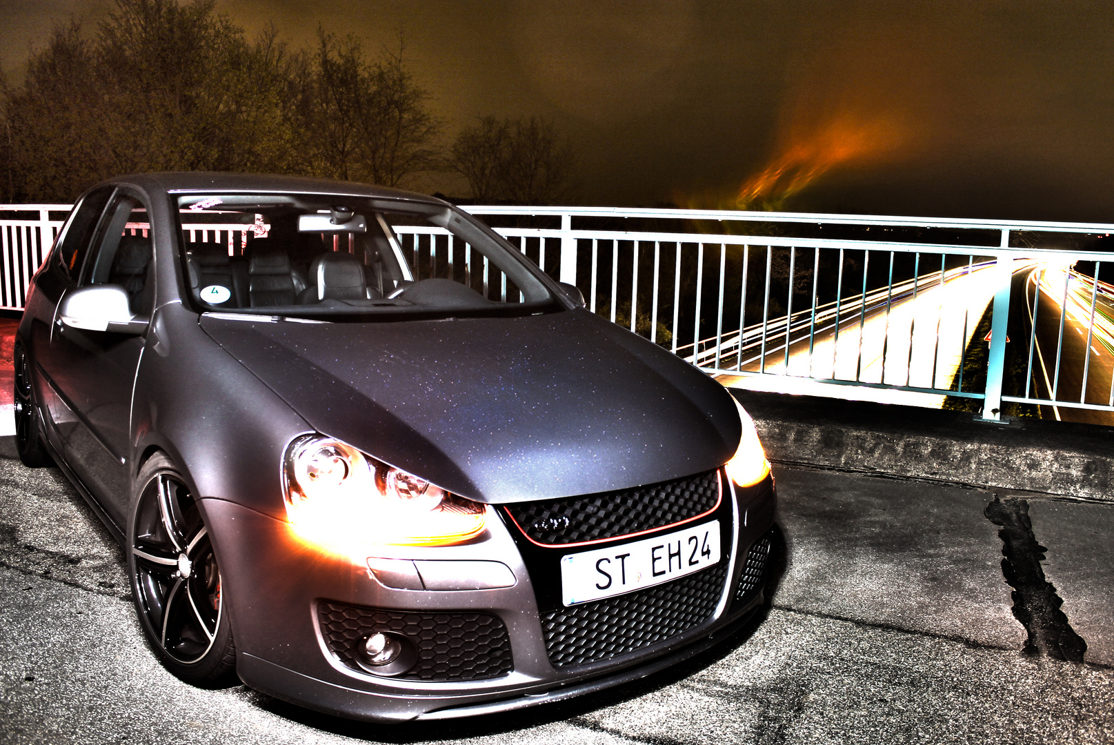 Golf GTI on unlighted Bridge