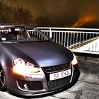 Golf GTI on unlighted Bridge