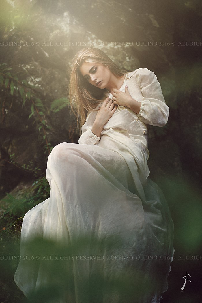 Graceful woman posing in dreamy forest 