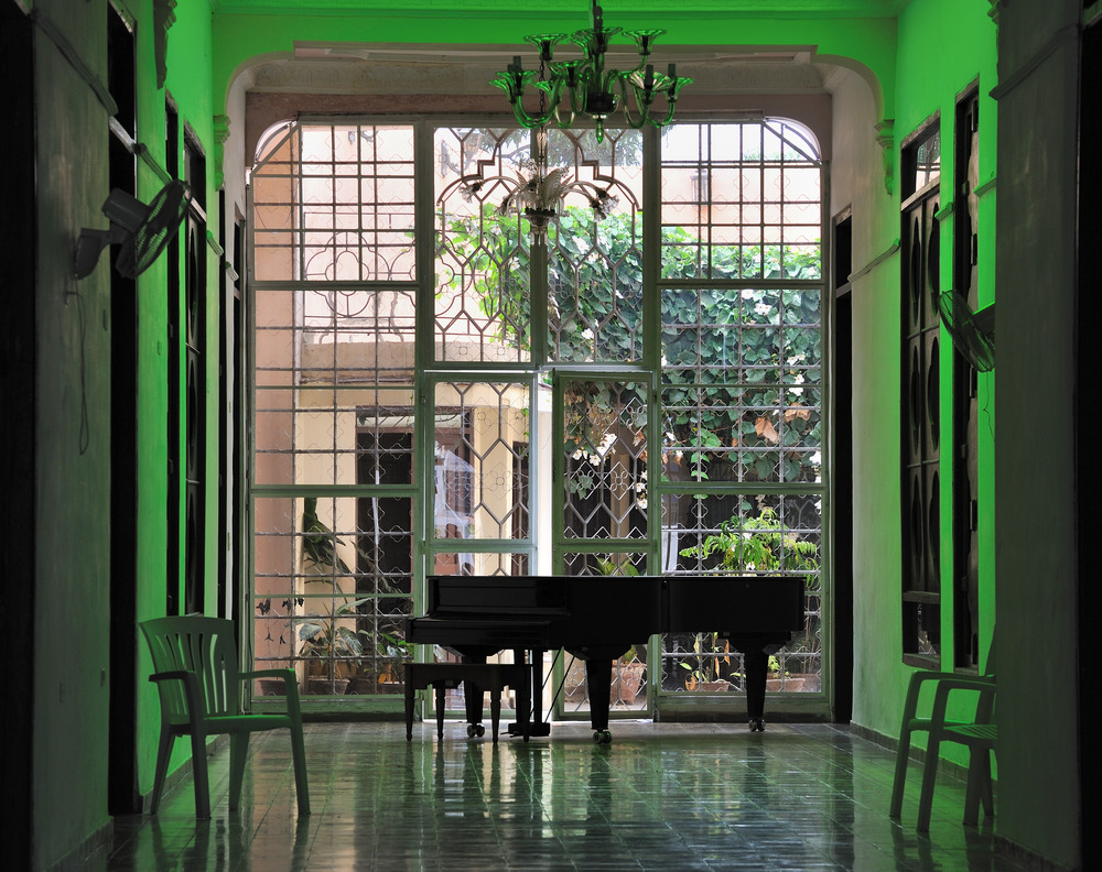 Grand Piano in a green room