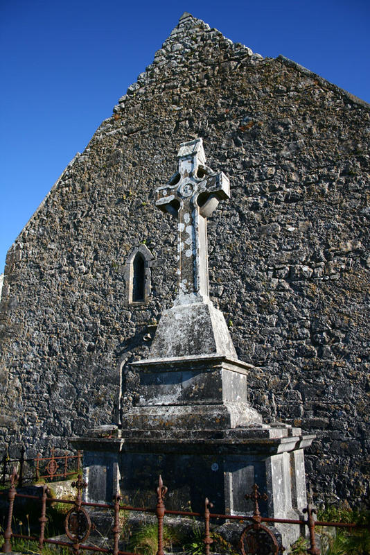 Grave in front of an old monastery