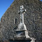 Grave in front of an old monastery