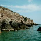 green water and yellow rocks