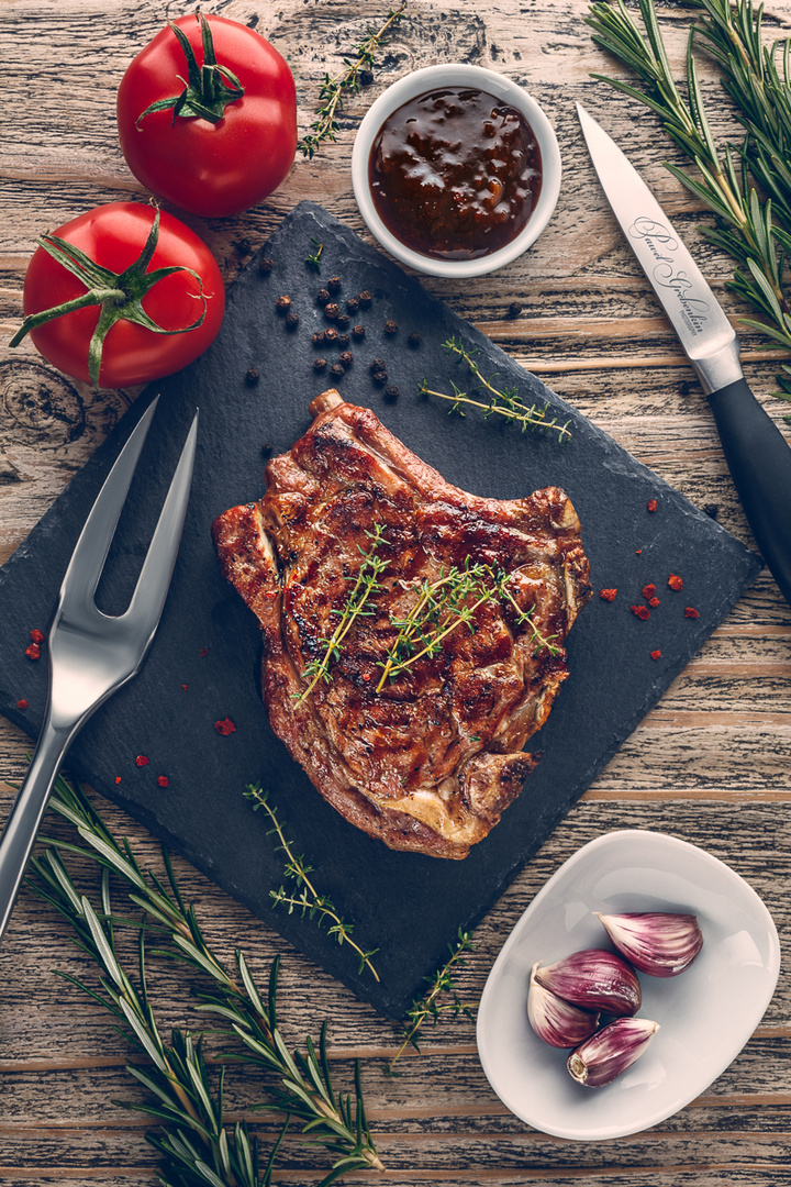 Grilled veal chop sous-vide with vegetables