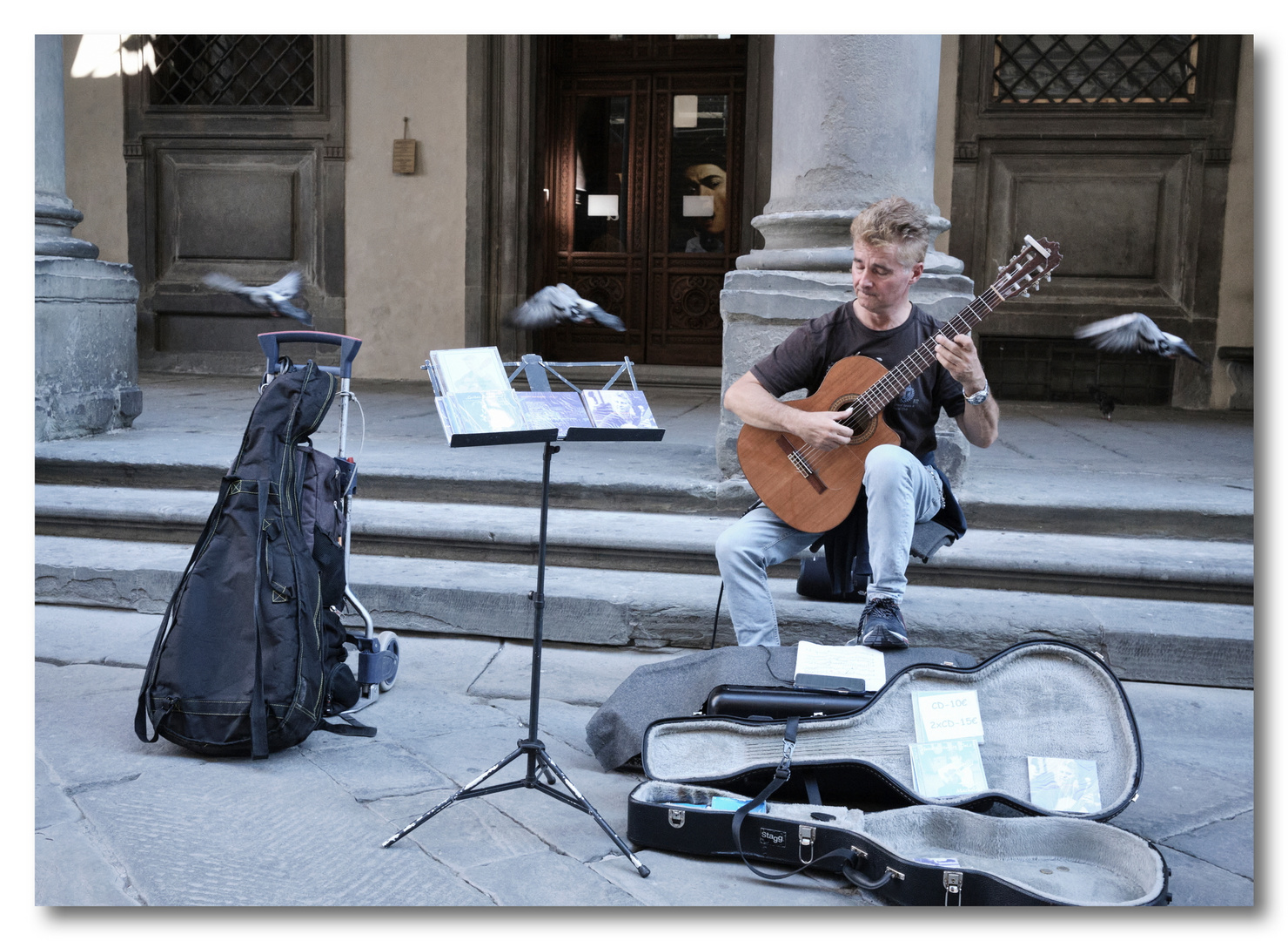 Guitar player with doves